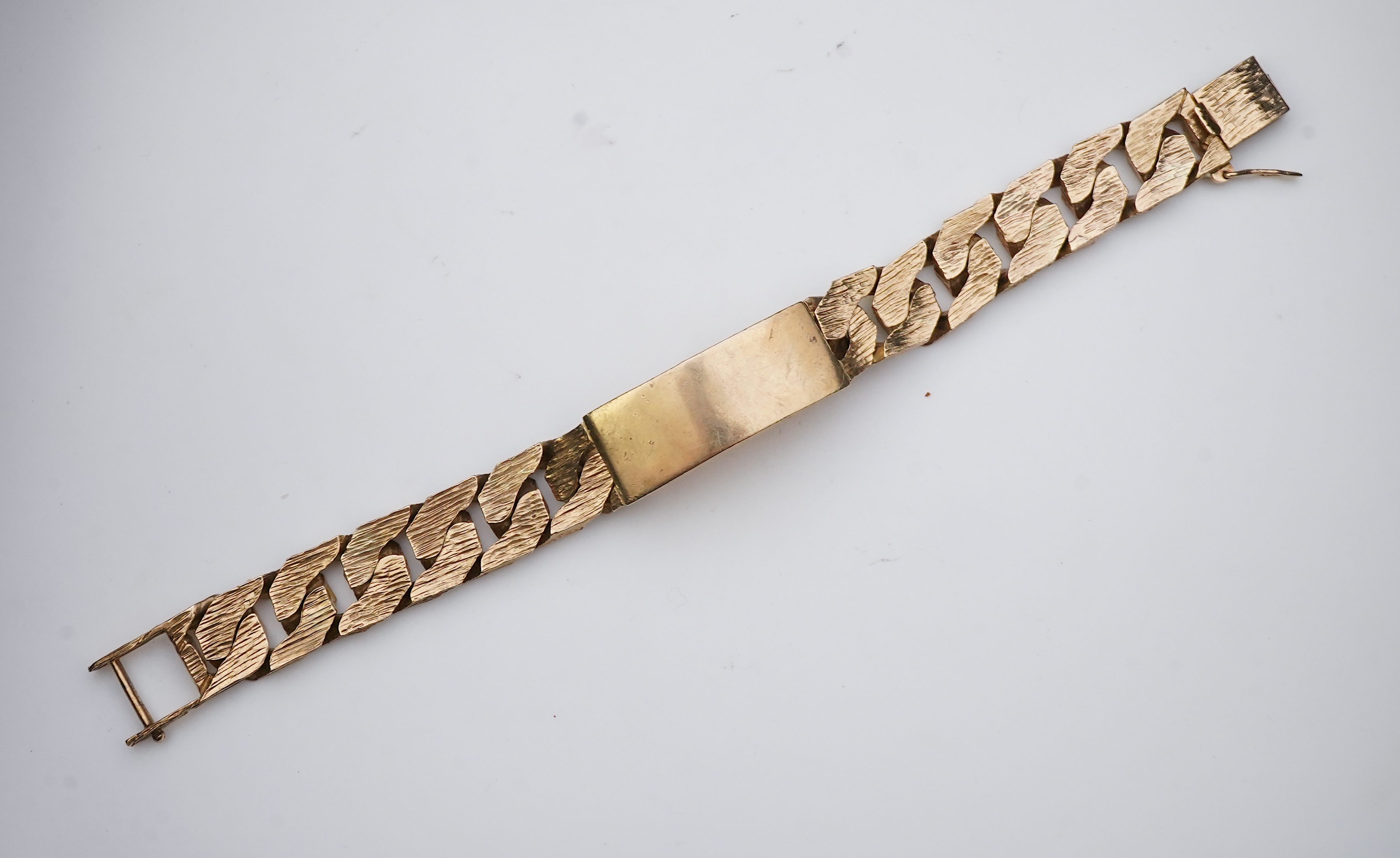 A 9ct gold identity bracelet, circa 1973